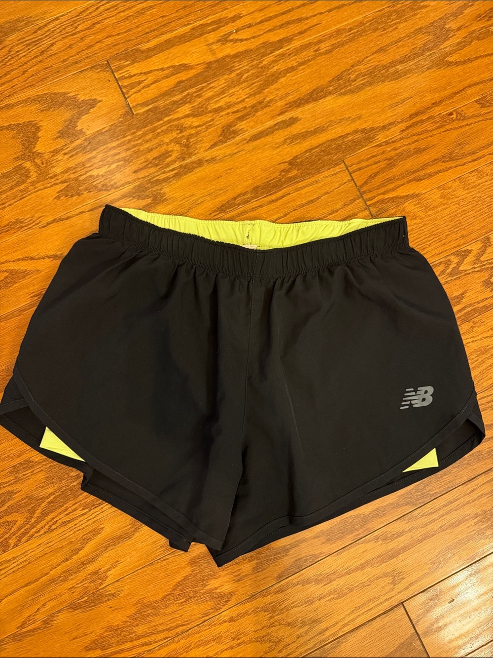 New Balance Black Women's Tempo Shorts with Yellow Liner